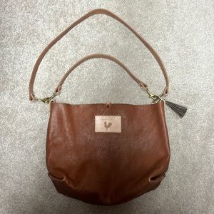 Meanwhile Back on the Farm saddle leather hobo and crossbody.